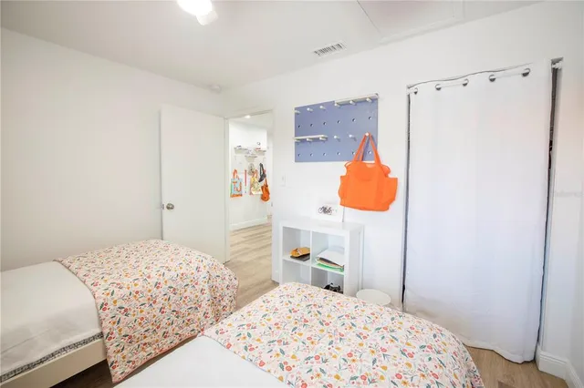 a bedroom with a bed and dresser