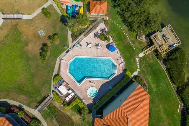 an aerial view of a house with a swimming pool