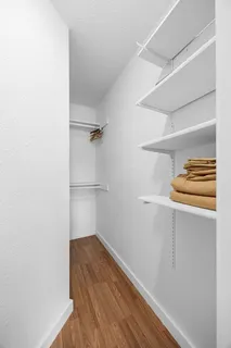 a bathroom with a shower sink and mirror