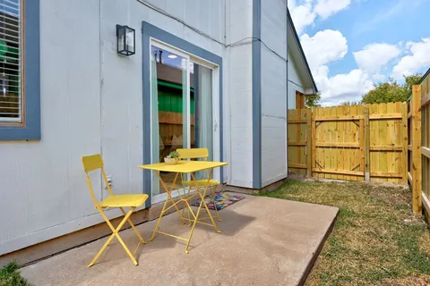 a backyard of a house with seating space
