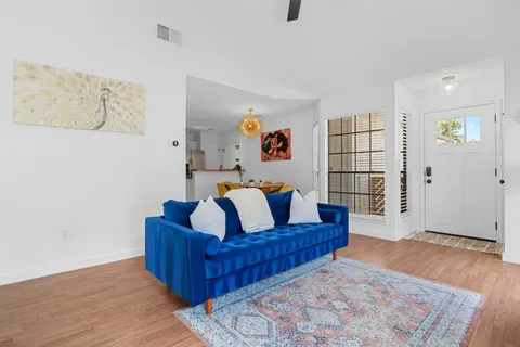 a view of a yard with wooden fence