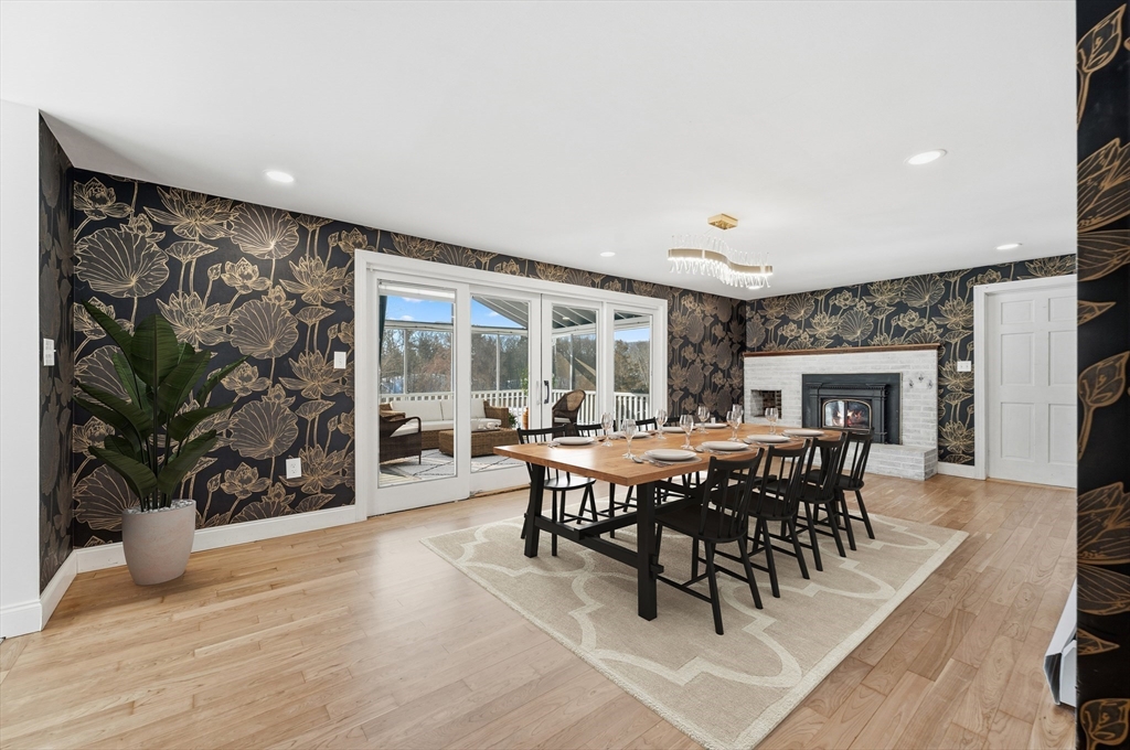 124 Everett Street Natick, MA 01760 - Photo 11 of 26 a view of a dining room with furniture and wooden floor