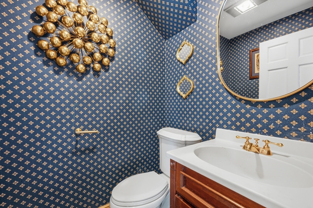 124 Everett Street Natick, MA 01760 - Photo 14 of 26 a bathroom with a sink and a toilet