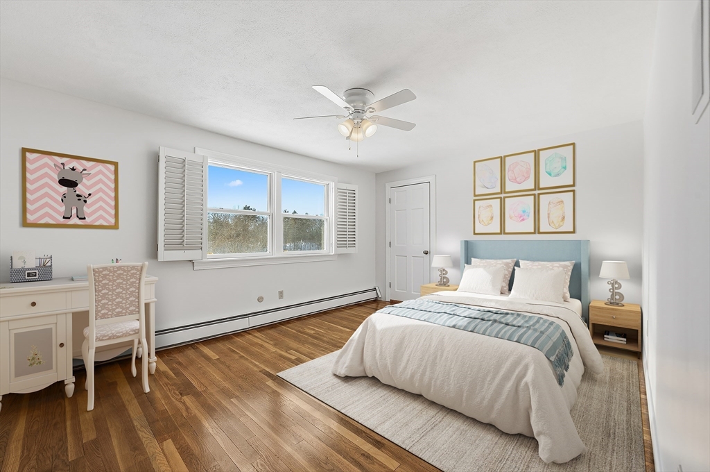 124 Everett Street Natick, MA 01760 - Photo 23 of 26 a bedroom with a large bed and a window