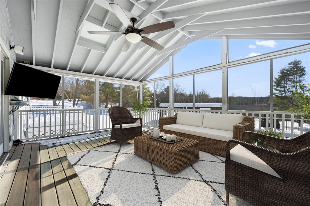 124 Everett Street Natick, MA 01760 - Photo 25 of 26 a living room with patio furniture and a flat screen tv