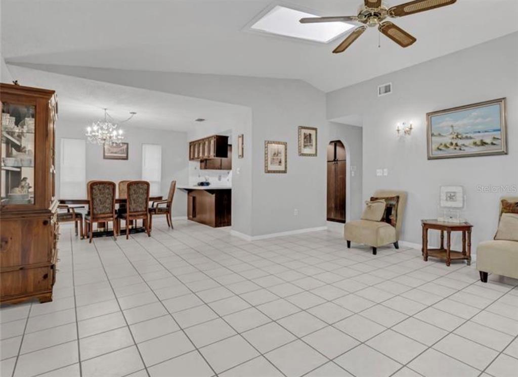 4308 Allen Road Fruitland Park, FL 34731 - Photo 7 of 33 a living room with furniture and a dining table