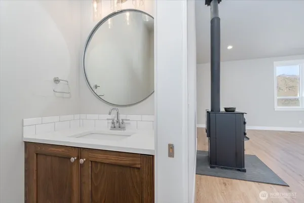 a bathroom with a sink and a mirror