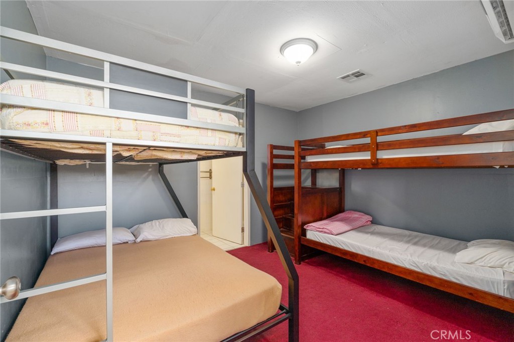 21871 Richard Street Perris, CA 92570 - Photo 13 of 75 a bedroom with a bunk bed and a dresser