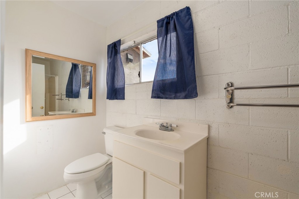 21871 Richard Street Perris, CA 92570 - Photo 14 of 75 a bathroom with a sink and a mirror
