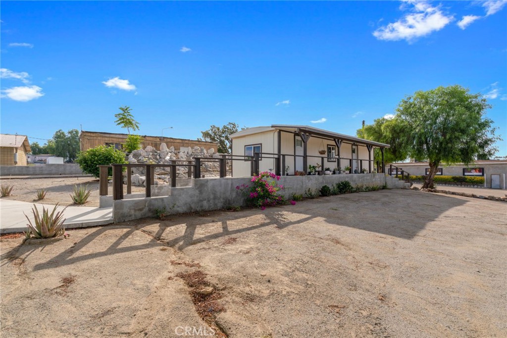 21871 Richard Street Perris, CA 92570 - Photo 16 of 75 a view of a house with a patio