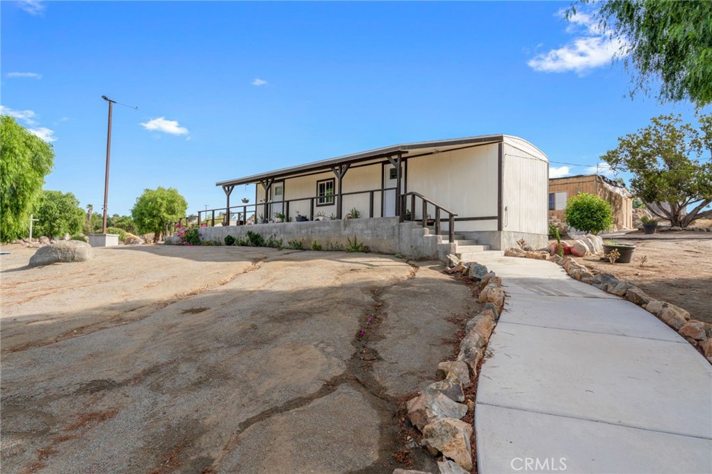 21871 Richard Street Perris, CA 92570 - Photo 17 of 75 a view of a house with a patio