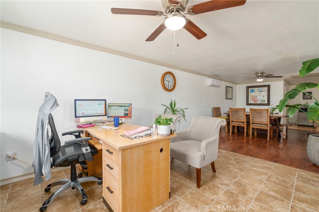 21871 Richard Street Perris, CA 92570 - Photo 18 of 75 a view of a workspace with furniture and a table