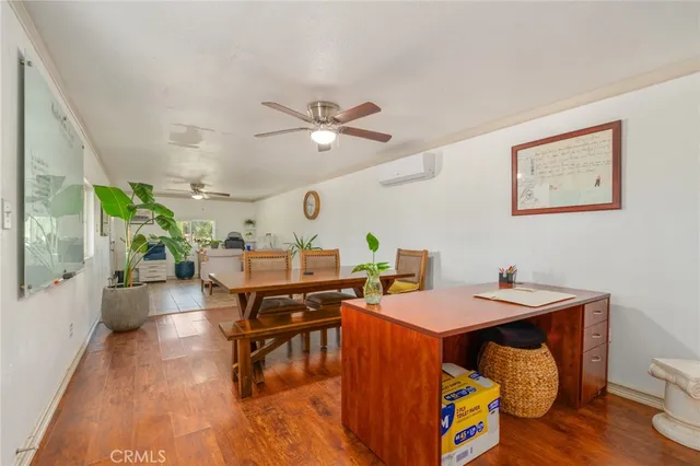 a front view of a house with a yard and outdoor seating
