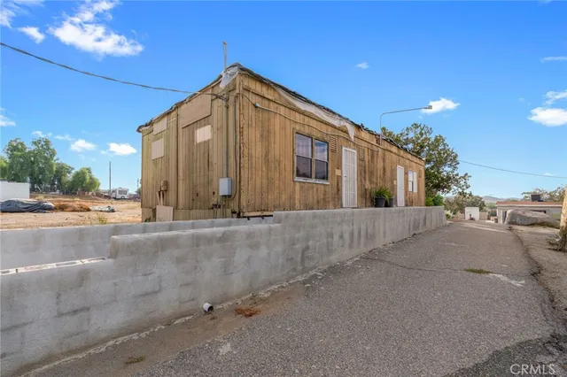 a swimming pool with outdoor seating and yard