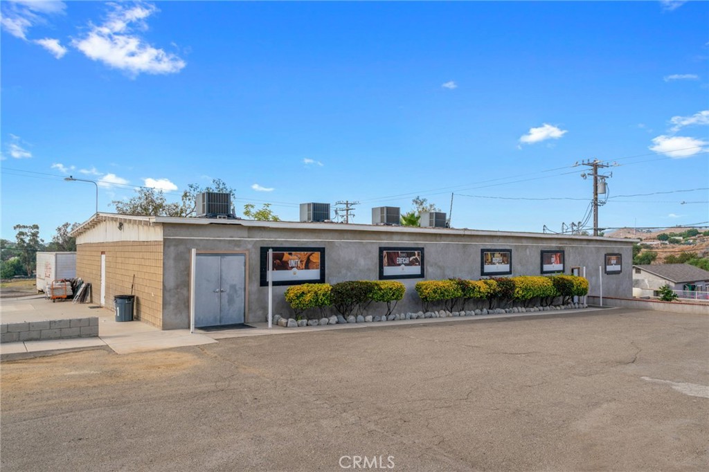 21871 Richard Street Perris, CA 92570 - Photo 27 of 75 a front view of a house with a yard and outdoor seating