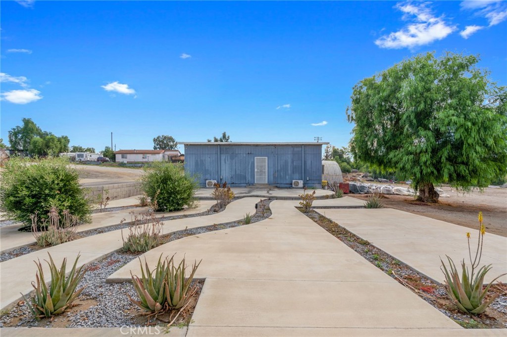 21871 Richard Street Perris, CA 92570 - Photo 30 of 75 a swimming pool with outdoor seating and yard