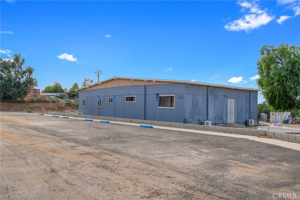 21871 Richard Street Perris, CA 92570 - Photo 31 of 75 a house with trees in front of it