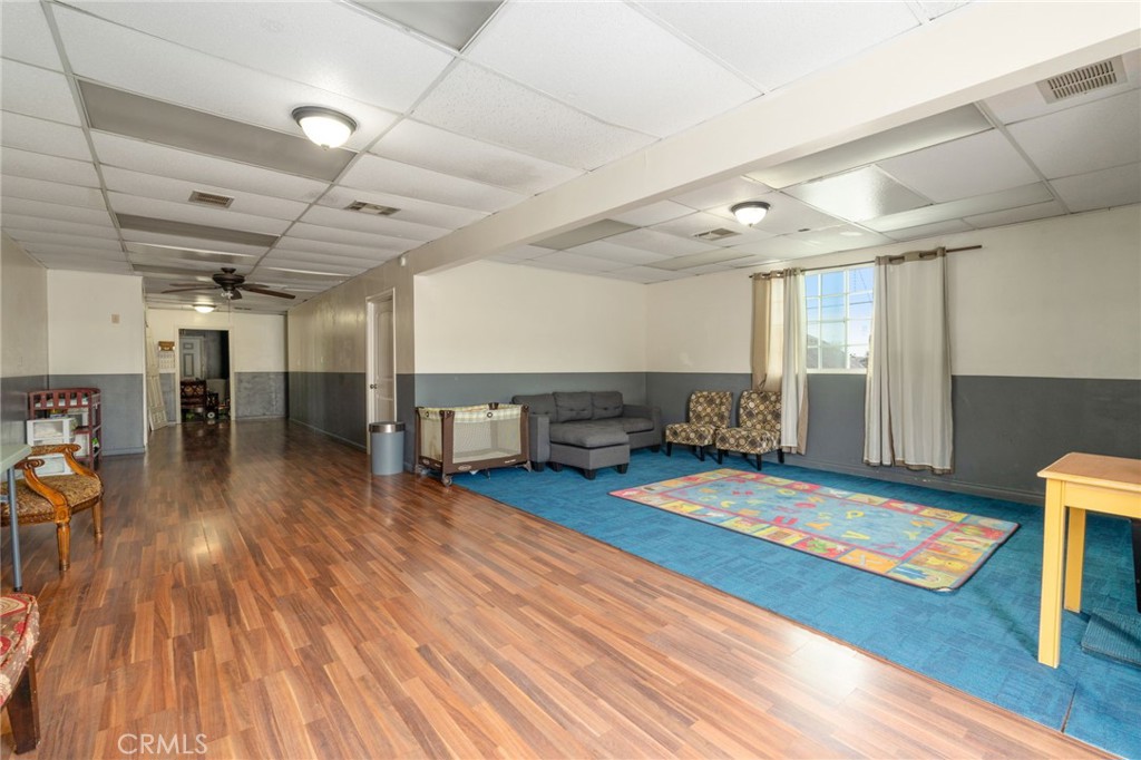 21871 Richard Street Perris, CA 92570 - Photo 32 of 75 a living room with furniture and a wooden floor