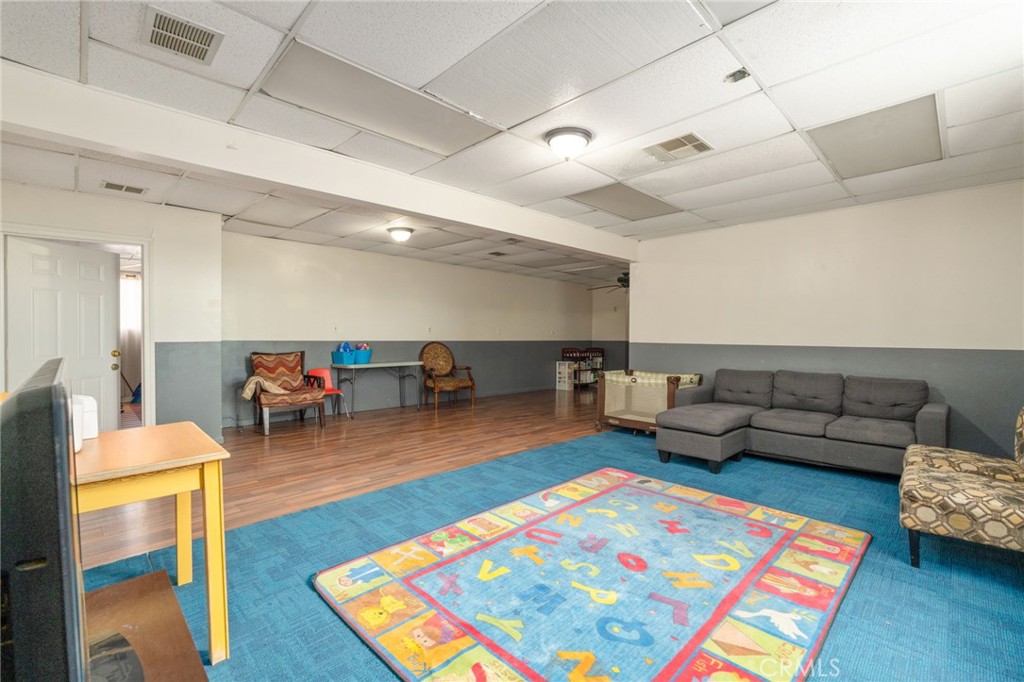 21871 Richard Street Perris, CA 92570 - Photo 33 of 75 a living room with furniture and a rug