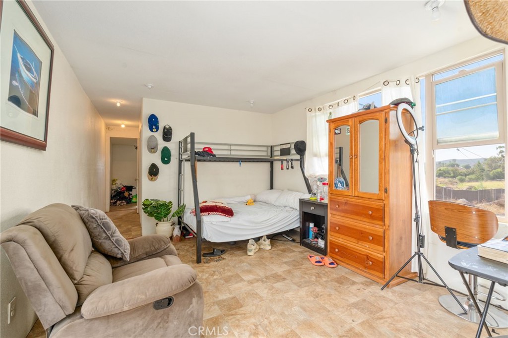 21871 Richard Street Perris, CA 92570 - Photo 39 of 75 a living room with furniture and a flat screen tv