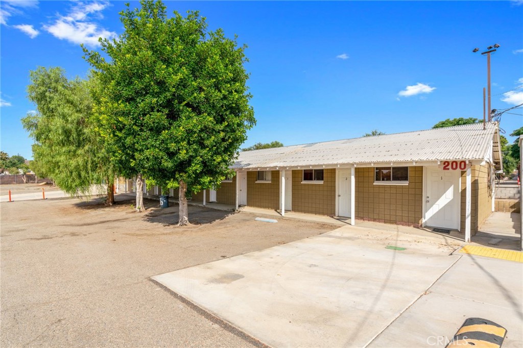21871 Richard Street Perris, CA 92570 - Photo 61 of 75 a front view of a house with a yard and potted plants