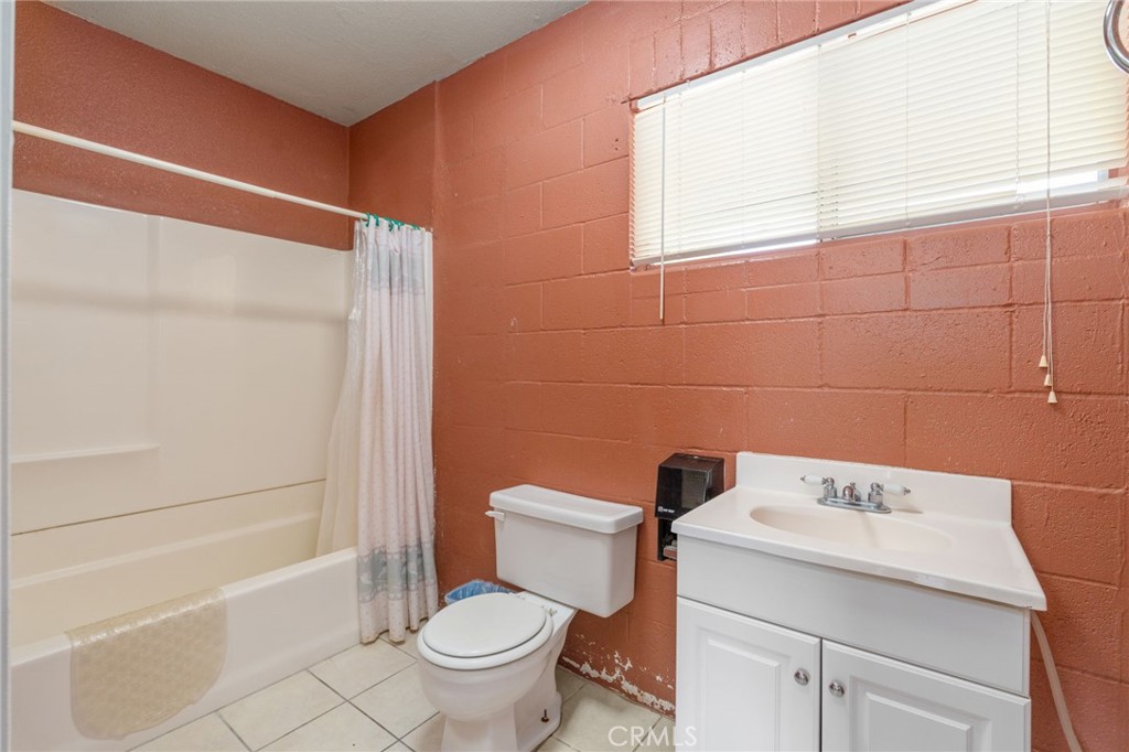 21871 Richard Street Perris, CA 92570 - Photo 66 of 75 a bathroom with a sink a toilet and shower