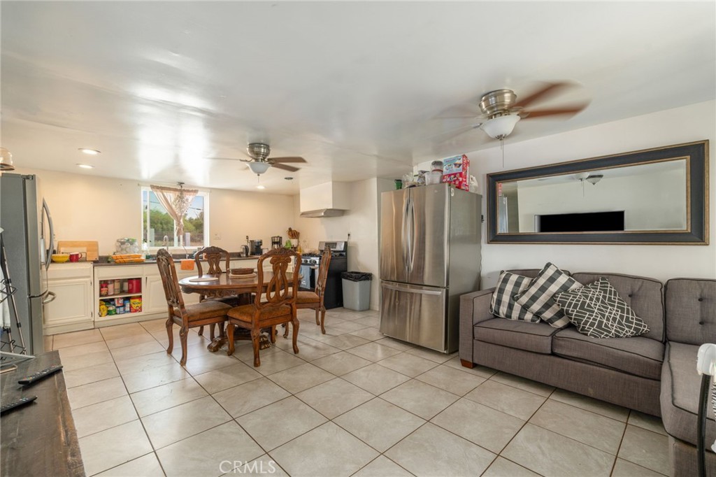 21871 Richard Street Perris, CA 92570 - Photo 68 of 75 a dining room with furniture and a kitchen view