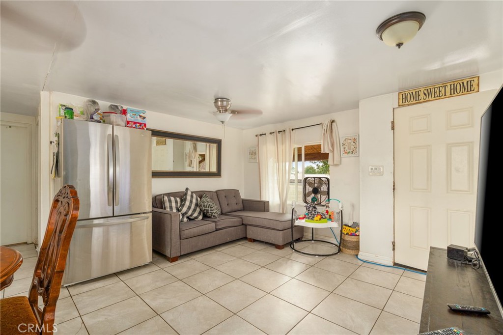 21871 Richard Street Perris, CA 92570 - Photo 70 of 75 a living room with furniture and a flat screen tv