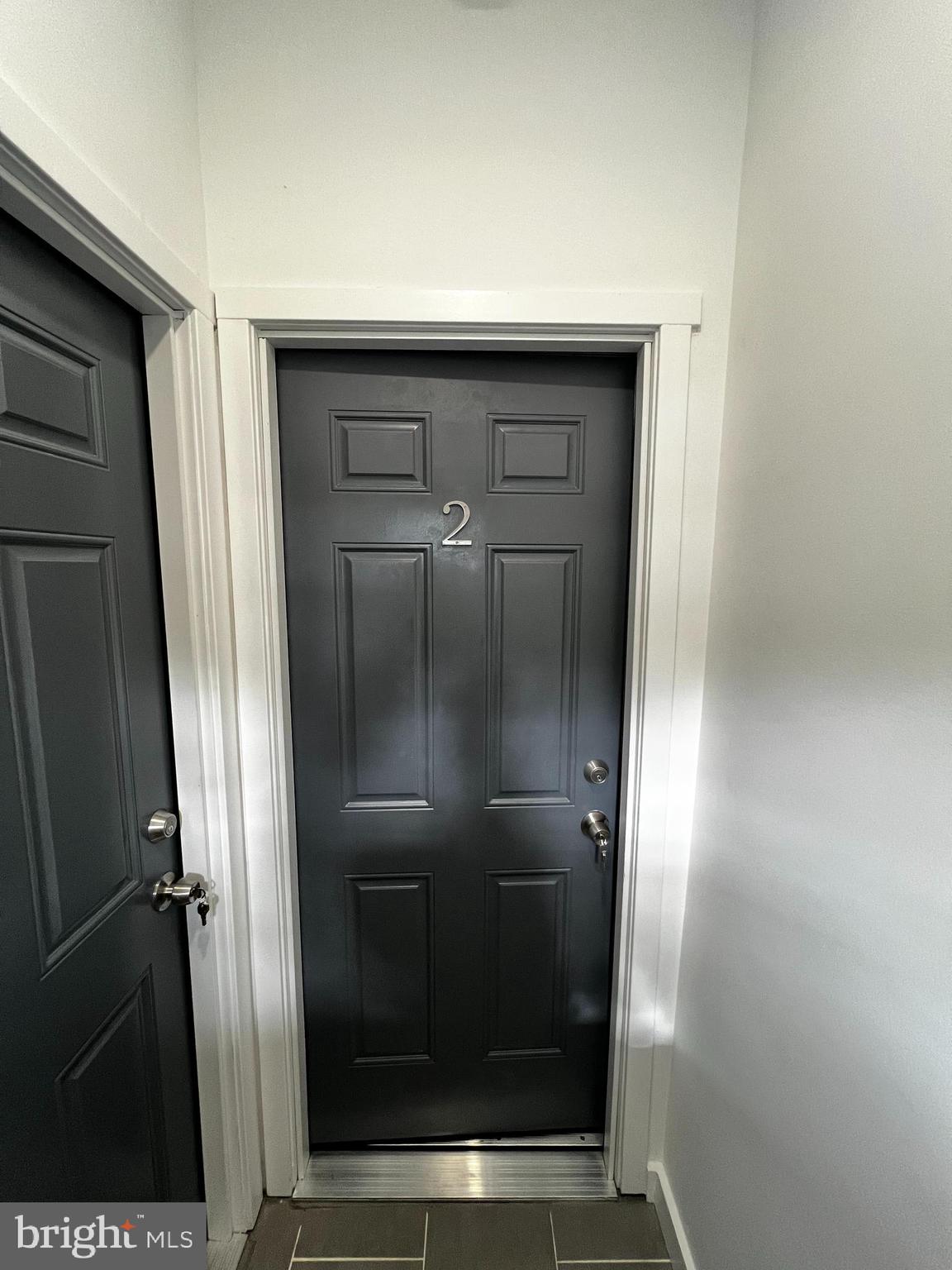 1551 Church Street, Unit 2 Philadelphia, PA 19124 - Photo 13 of 14 a bathroom with a glass shower door