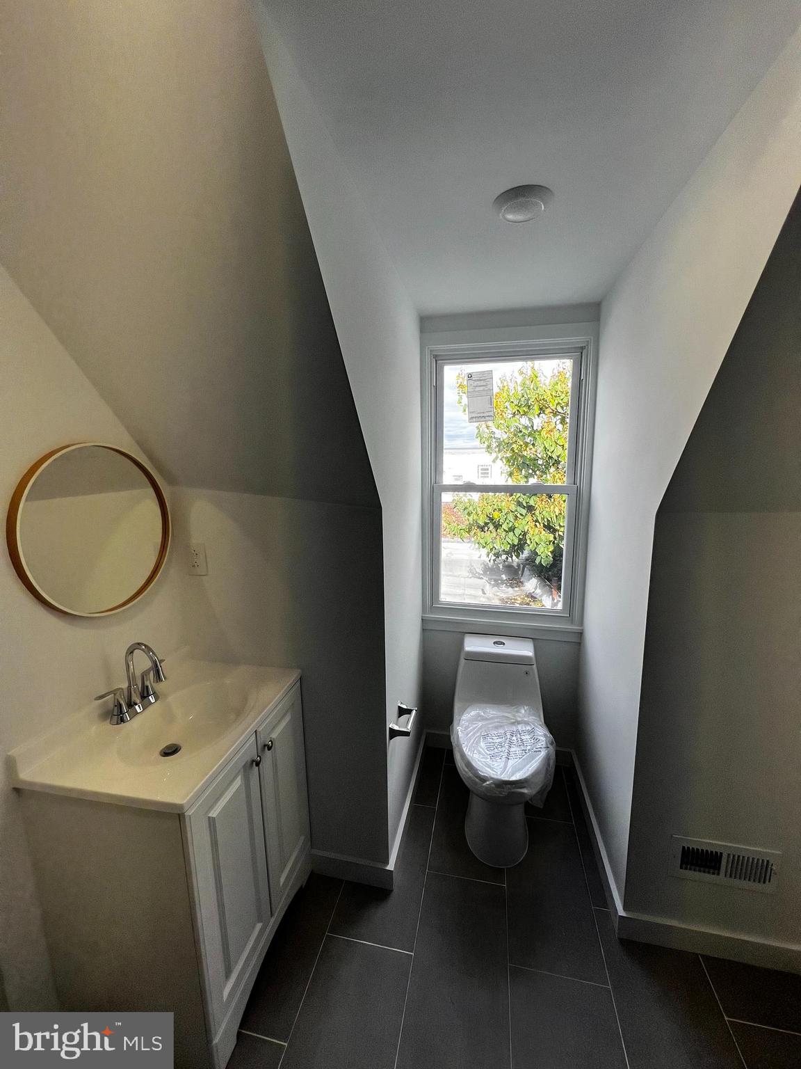 1551 Church Street, Unit 2 Philadelphia, PA 19124 - Photo 9 of 14 a bathroom with a sink and a mirror