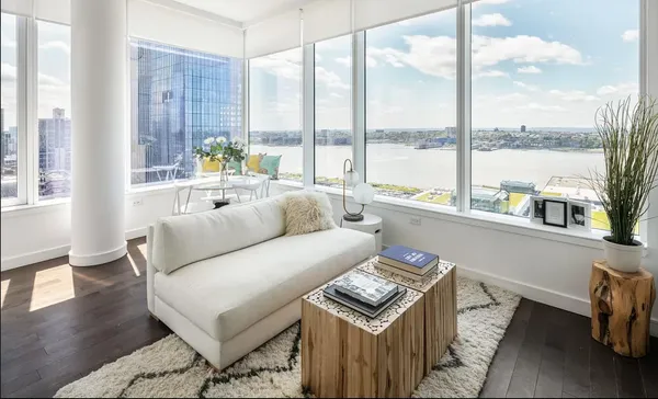 a living room with furniture and a large window
