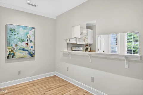 a view of kitchen with wooden floor and window