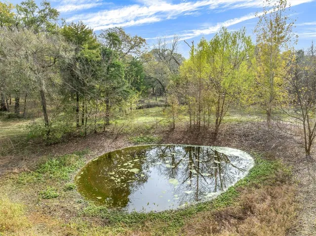 a kitchen with kitchen island a sink stainless steel appliances and cabinets