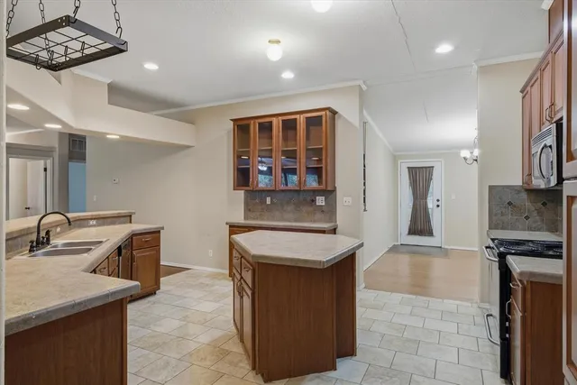 a kitchen with a stove and a microwave