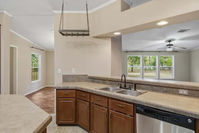 a view of kitchen with furniture and stainless steel appliances