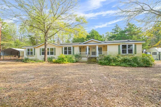 front view of a house with a small yard