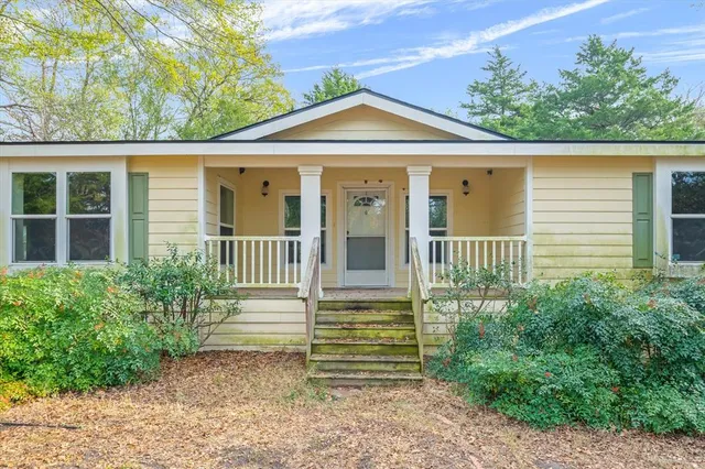 a view of a yard with a trees