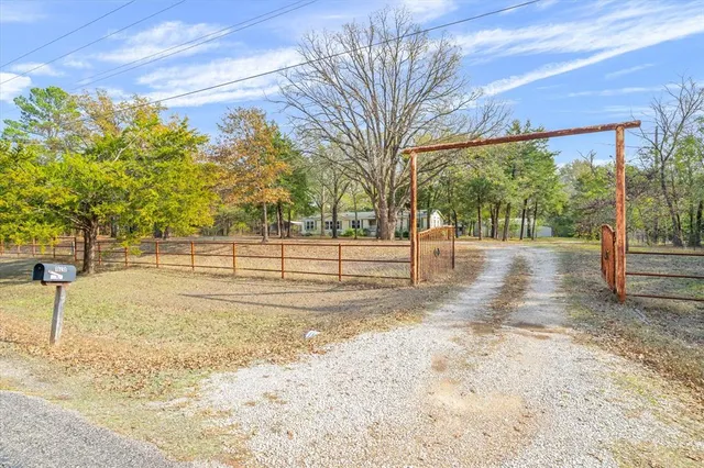 a view of a back yard from a balcony