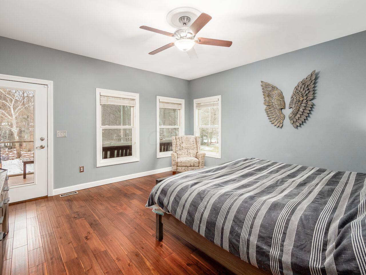 3737 Olentangy River Road Delaware, OH 43015 - Photo 20 of 70 The primary bedroom is on the first level and has private bath room and views of the yard and water.