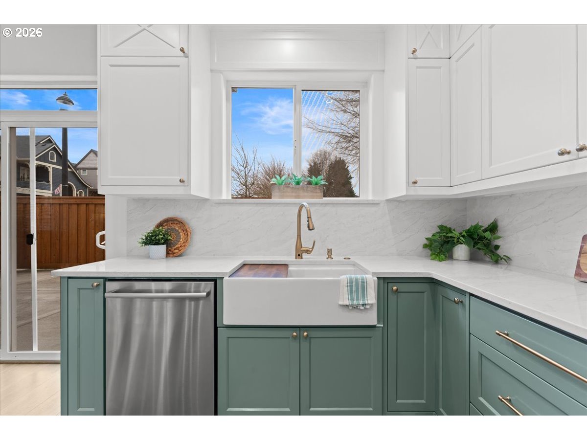 11595 Southwest Butte Lane Beaverton, OR 97008 - Photo 14 of 48 a kitchen with a sink a cabinets and window
