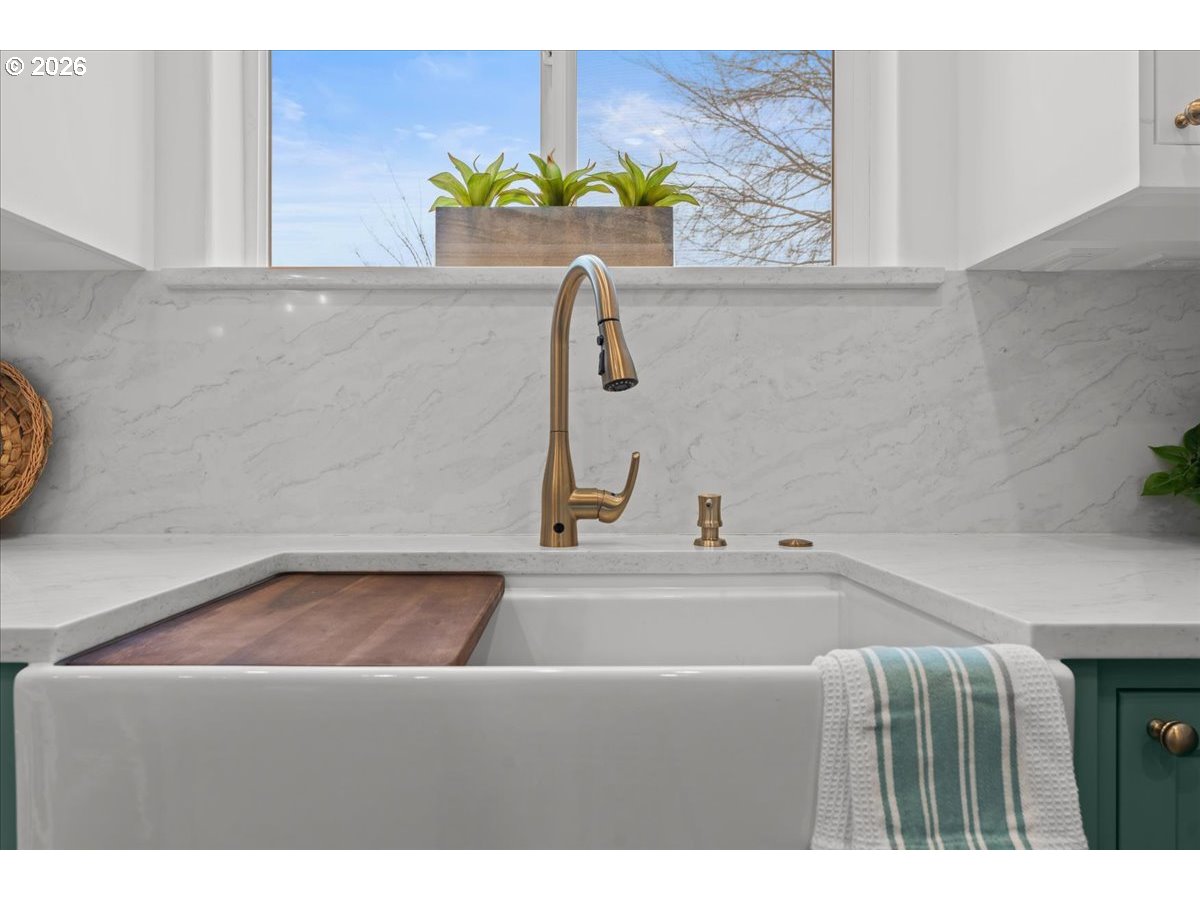 11595 Southwest Butte Lane Beaverton, OR 97008 - Photo 17 of 48 a bathroom with a sink and a window