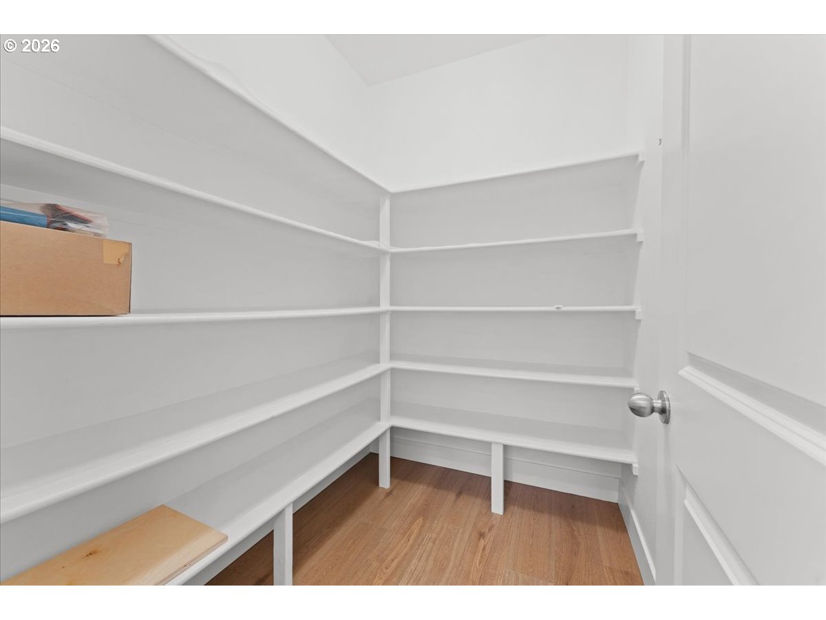 11595 Southwest Butte Lane Beaverton, OR 97008 - Photo 20 of 48 a wooden floor with a book shelf