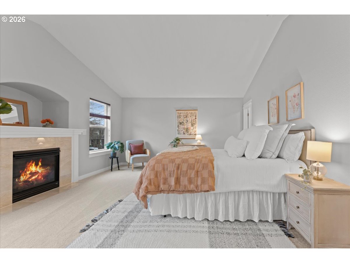 11595 Southwest Butte Lane Beaverton, OR 97008 - Photo 26 of 48 a living room with furniture and a fireplace