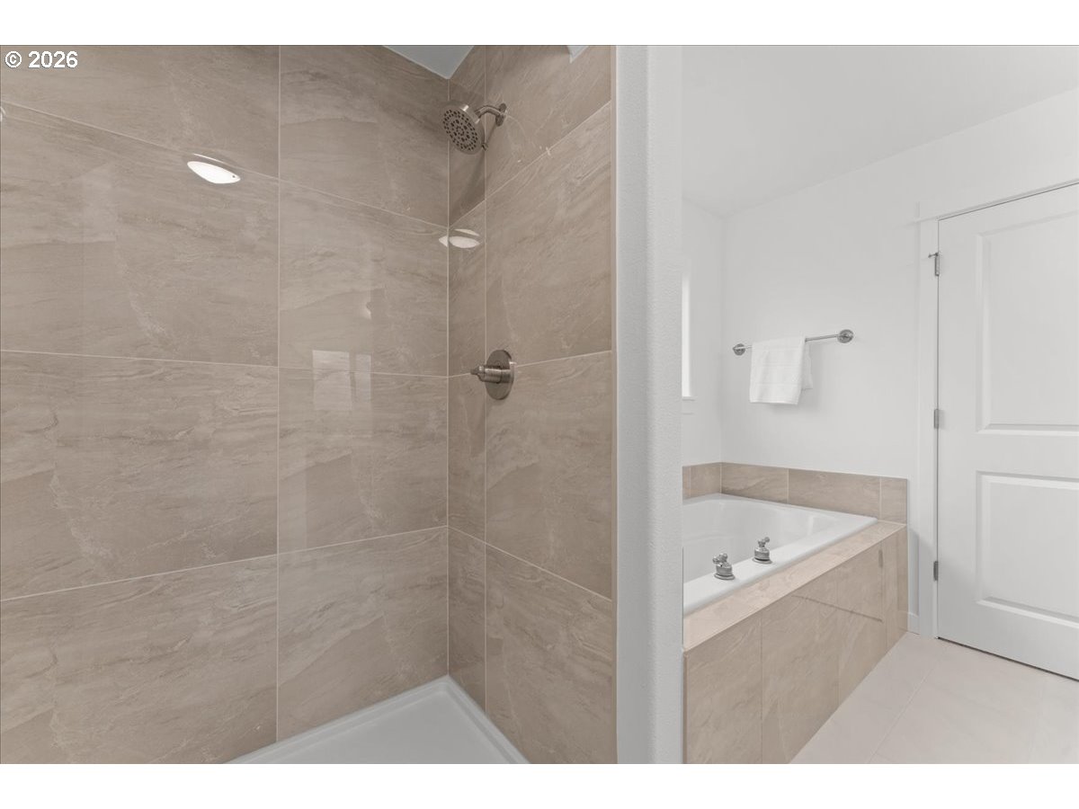 11595 Southwest Butte Lane Beaverton, OR 97008 - Photo 32 of 48 a bathroom with a tub a sink and a shower