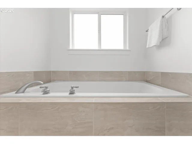 a bathroom with a shower curtain a sink and a toilet