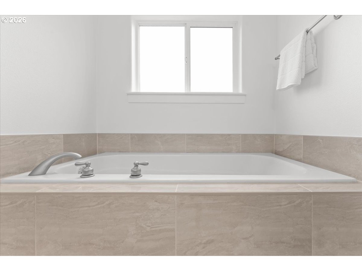 11595 Southwest Butte Lane Beaverton, OR 97008 - Photo 33 of 48 a bathroom with a bathtub and a sink