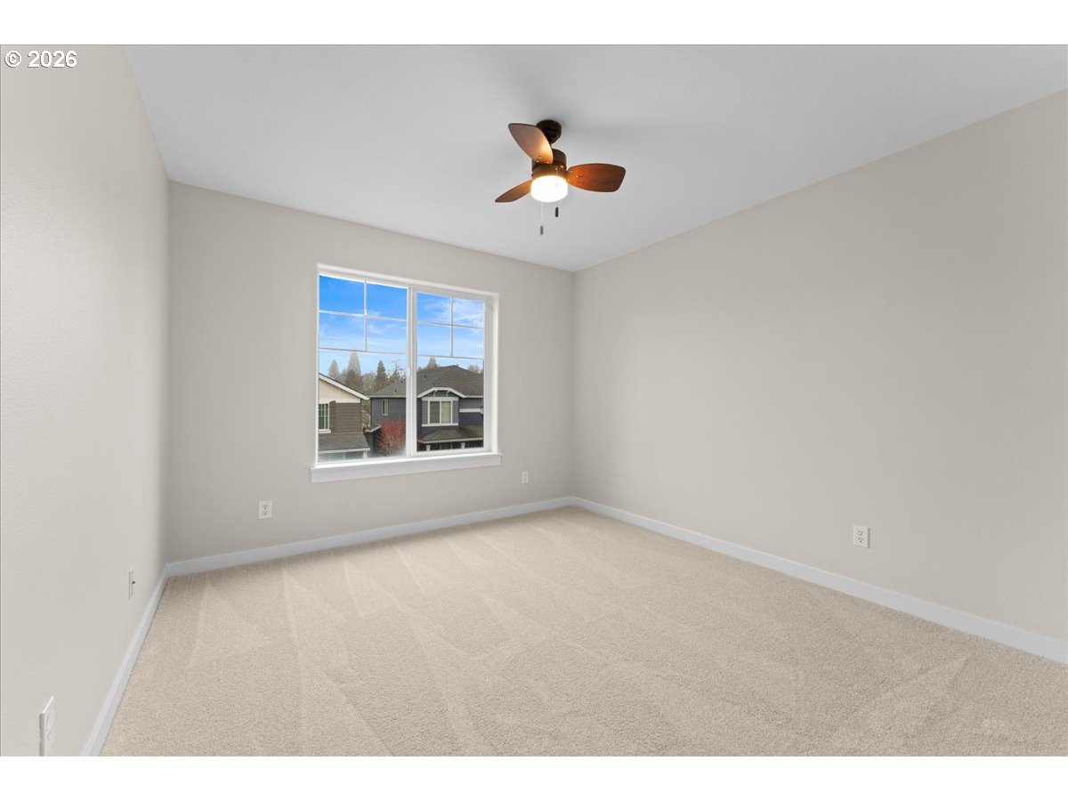 11595 Southwest Butte Lane Beaverton, OR 97008 - Photo 36 of 48 a view of an empty room with a window