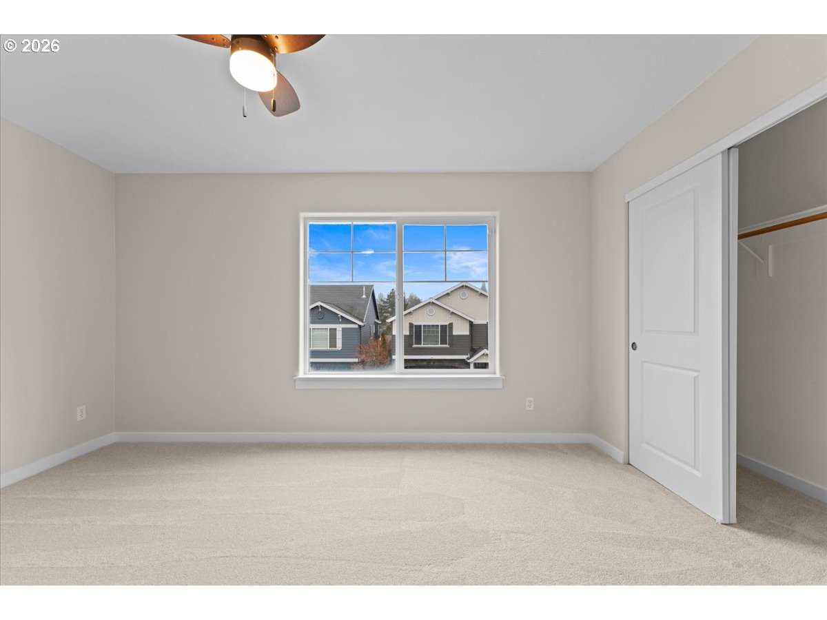 11595 Southwest Butte Lane Beaverton, OR 97008 - Photo 40 of 48 a view of an empty room with a window