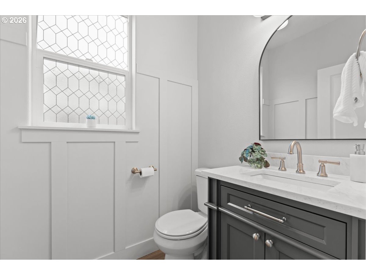 11595 Southwest Butte Lane Beaverton, OR 97008 - Photo 8 of 48 a bathroom with a granite countertop toilet sink and mirror