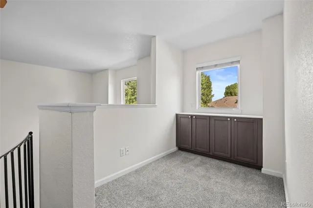 a view of an empty room and window